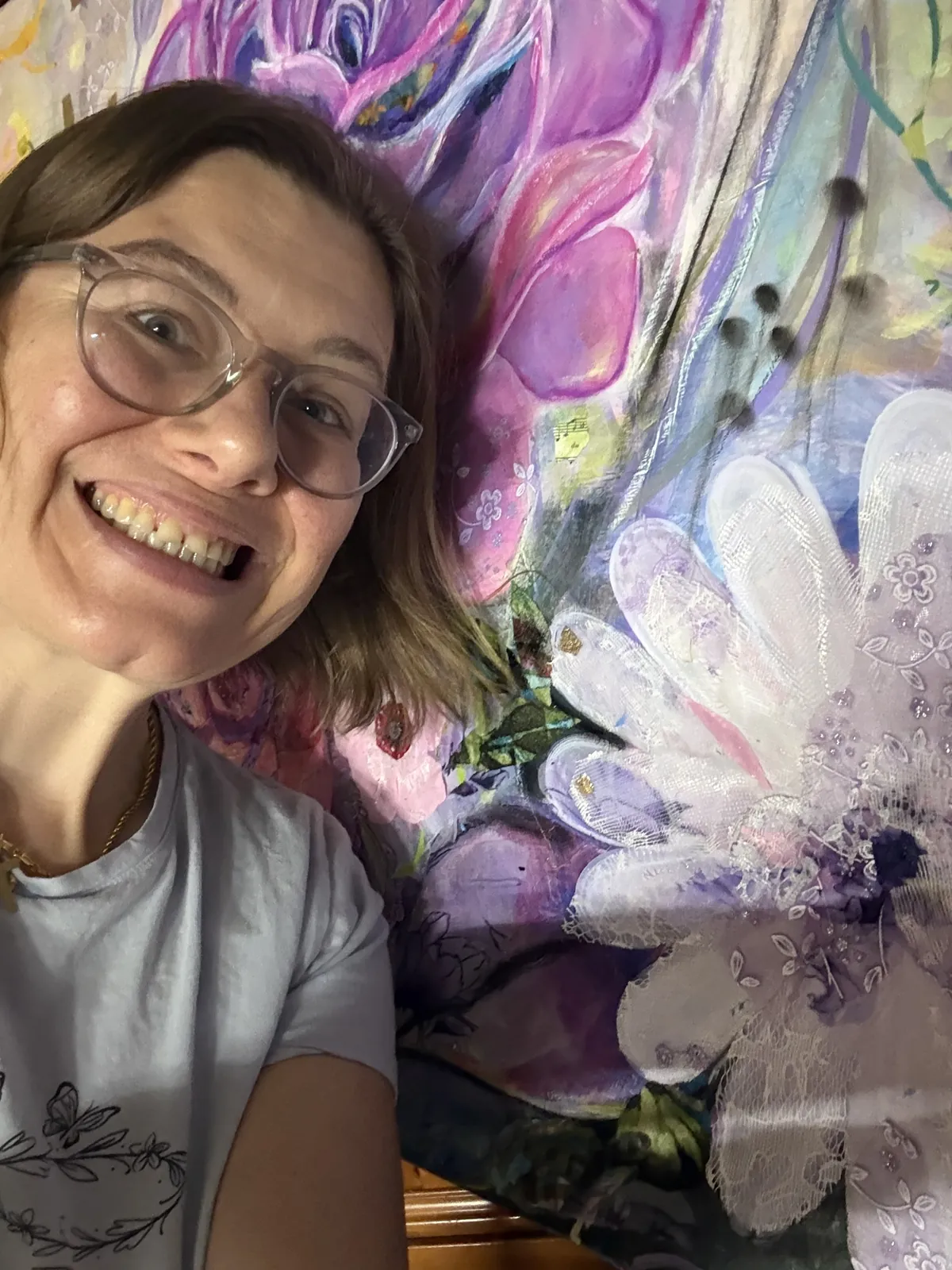 Agata May'kowska laughing next to the nearly finished floral commission