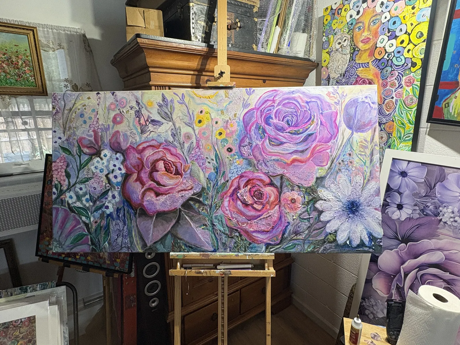 Commission in progress by Agata May'kowska — a large textured painting of purple and pink roses and daisies on the studio easel