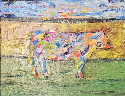 Sold original by Agata May'kowska — Collage art of a cow made from colorful paper pieces against a textured background of a sunrise or sunset with a landscape.
