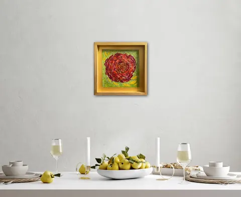 Sold original by Agata May'kowska — Dining table set with white plates, bowls, two glasses of white wine, a bowl of yellow apples, and candles, with a framed floral painting on a white wall