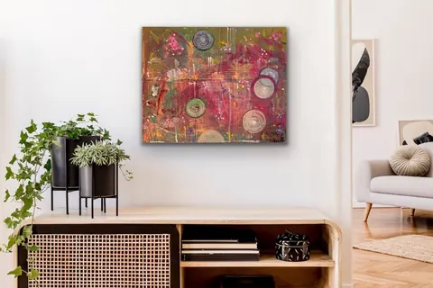 Sold original by Agata May'kowska — Inside a modern living room with a colorful abstract painting on the wall, a wooden console table with black planters holding green plants, and a beige sofa with…