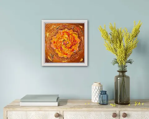 Sold original by Agata May'kowska — A light wooden console with decorative panels, topped with two books, a white textured vase, a small blue glass jar, and a tall dark gray vase with yellow flowers. On…