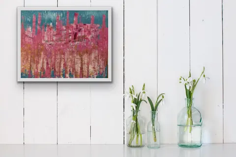 Sold original by Agata May'kowska — Three glass bottles with snowdrop flowers arranged on a white surface in front of a white wooden wall, with a colorful abstract painting hanging on the wall.