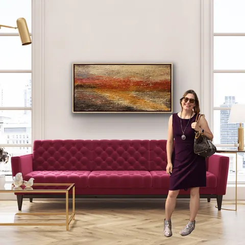 Sold original by Agata May'kowska — Woman in purple dress standing in modern living room with pink tufted sofa, abstract landscape painting on white wall, large windows showing cityscape, and gold accents.